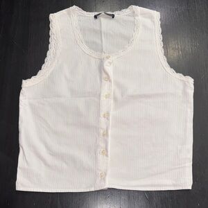 brandy melville white cotton tank top. trimmed with lace. button up. like new.